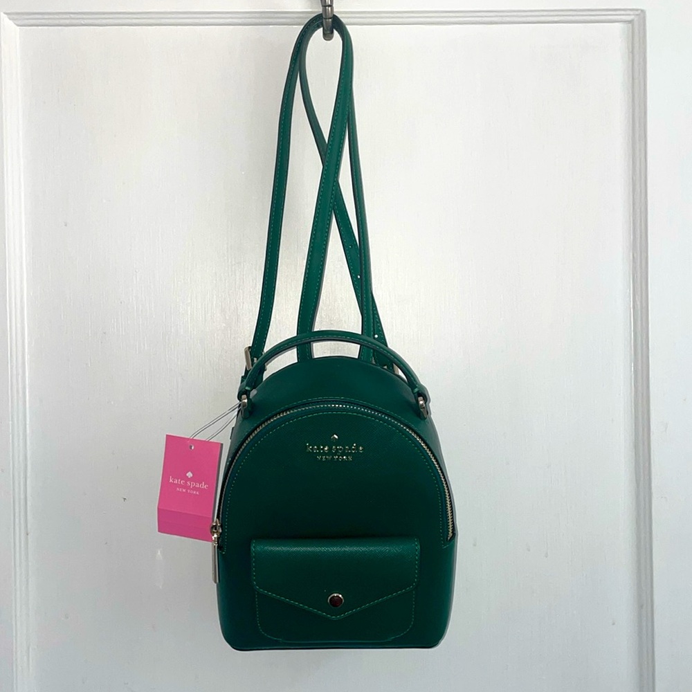 Kate Spade mini backpack in dark green.